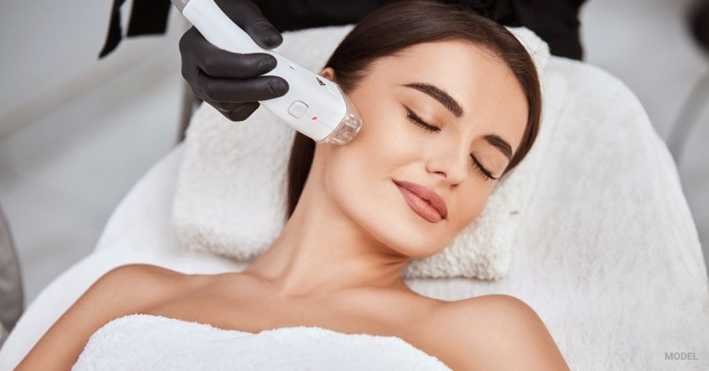 woman receiving facial laser hair services (MODEL)